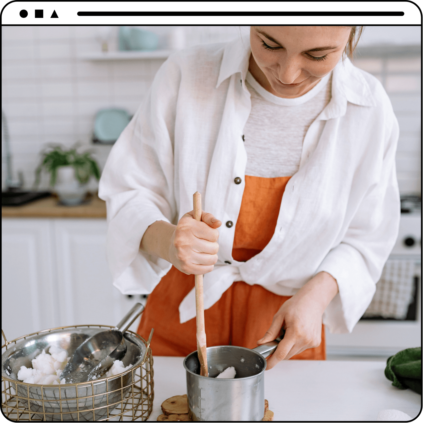 woman mixing melted wax in pot with wooden spoon